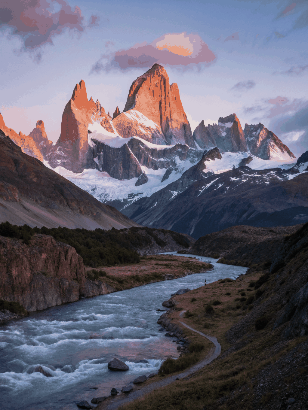 Golden hour light hitting the granite peaks of Fitz Roy